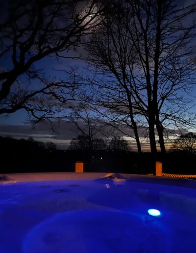 Moonlit hot tub at mallory meadows cabin leicestershire