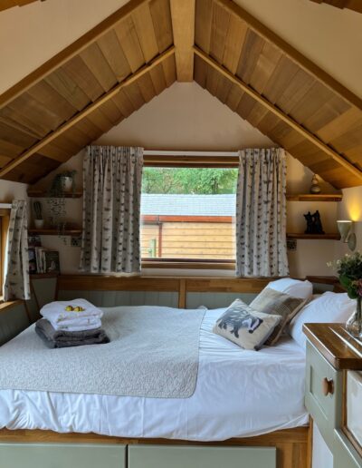 Inside Badger cabin, bed and kitchen