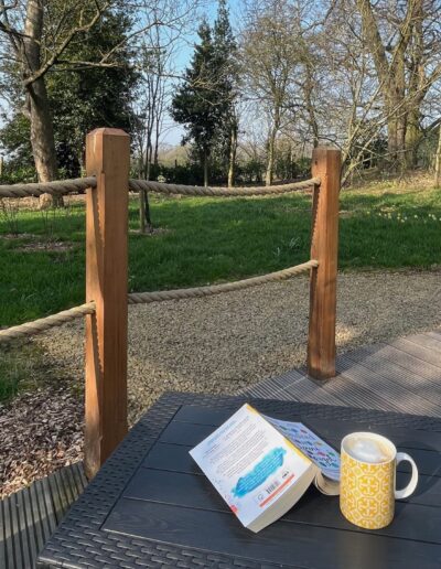 Catching up on a good book with coffee in the Leicestershire countryside.