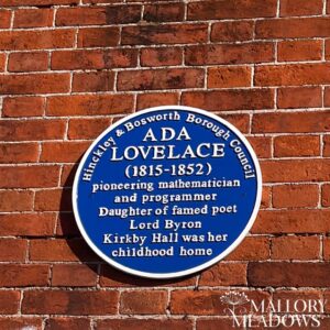Ada Lovelace blue plague located on the corner of old coach house at Mallory Park, Kirkby Mallory. 